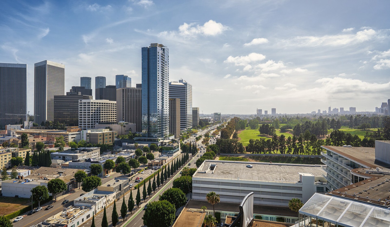The Century City skyline beside the green fairways of the Los Angeles Country Club