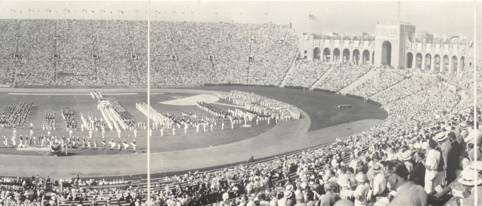 The Los Angeles Memorial Coliseum packed for the opening ceremony of the 1932 Olympic Games, athletes assembled on the field and the Peristyle arches at the far end