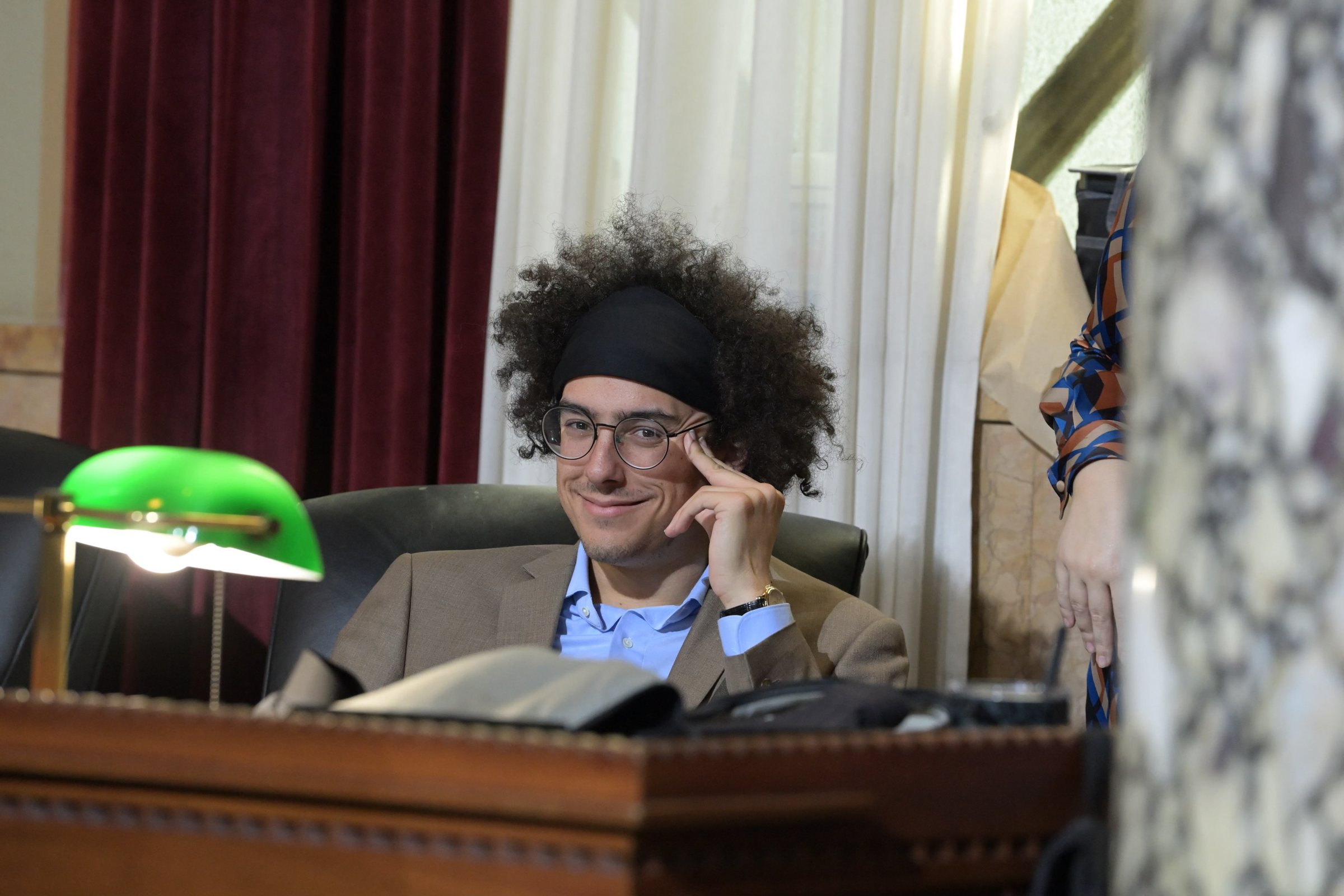 Miles Morton seated at the dais in the Los Angeles City Council chamber