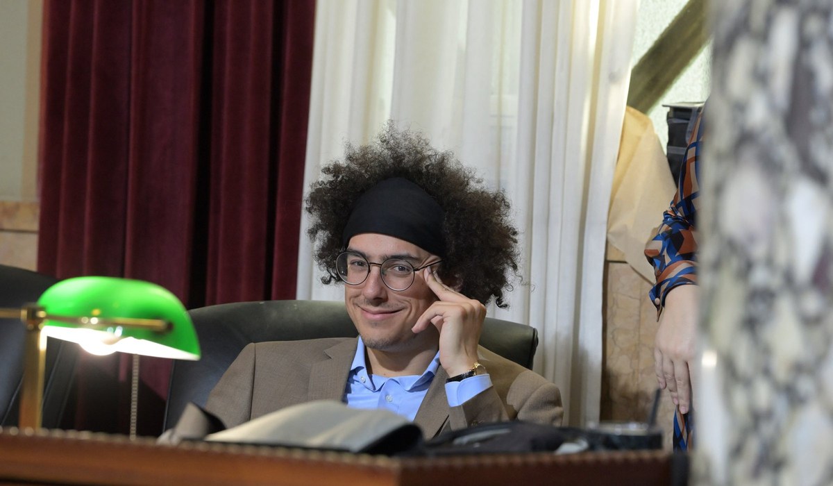 Miles Morton seated at the dais in the Los Angeles City Council chamber.